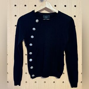 black cardigan sweater with silver buttons along the side